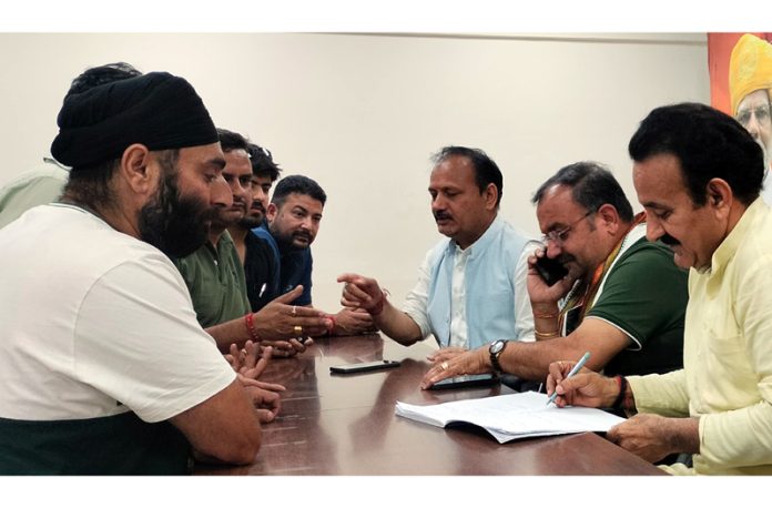 MLA Vikram Randhawa listening public grievances during public darbar at BJP headquarters.