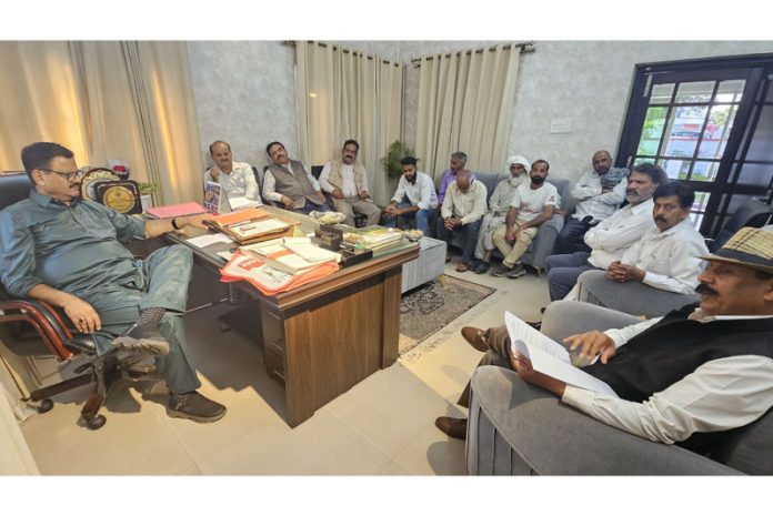 Minister Javed Rana meeting a delegation on Tuesday.