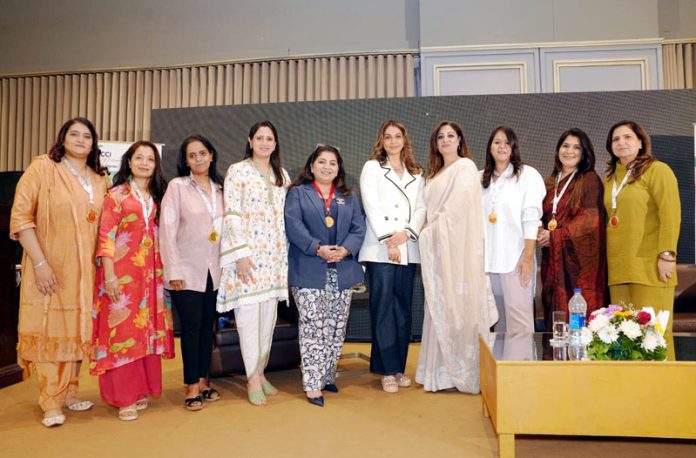 Bollywood actor Isha Koppikar and Dr Hiena Shafi Bhat posing along with others during a function organized in Jammu on Saturday.