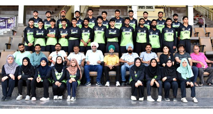 J&K cricket team posing along with dignitaries during selection trials.