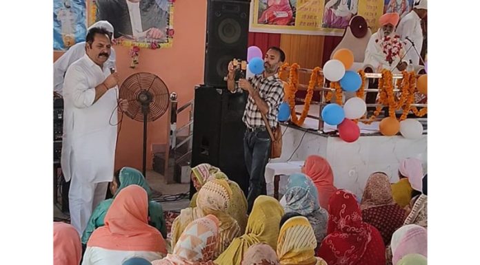 Swami Gurdeep Giri addressing religious gathering to mark Parkash Utsav of Guru Ravi Dass Ji at Kattal Batal in Nagrota. Chairman, SC Cell of JKNC is also seen in the picture.