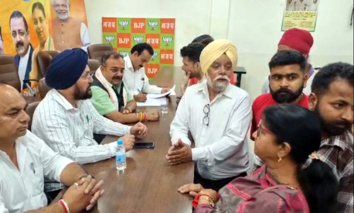 BJP MLAs listening people's issues at a public darbar at party headquarters Trikuta Nagar on Wednesday. BJP MLAs listening people's issues at a public darbar at party headquarters Trikuta Nagar on Wednesday.