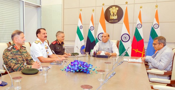 Defence Minister Rajnath Singh chairing a meeting in New Delhi on Tuesday. (UNI)