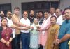 Sat Sharma distributing Ayushman Bharat Cards to beneficiaries during a camp by BJP at Gadigarh on Sunday.