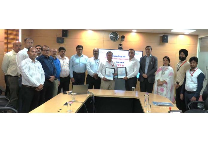 Top executives displaying copies of agreement signed between CVPPL and J&K Bank.