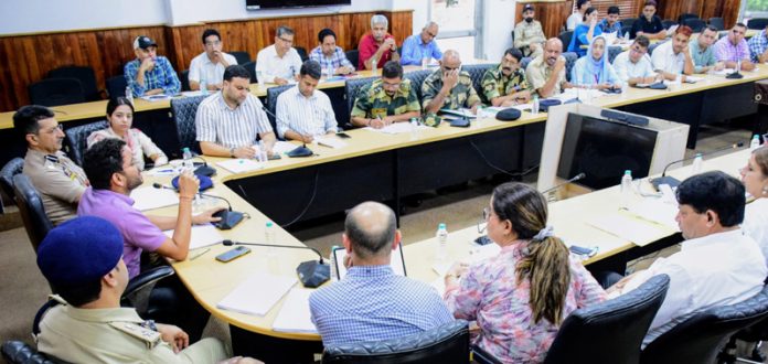 DC Jammu chairing a meeting on Sunday.