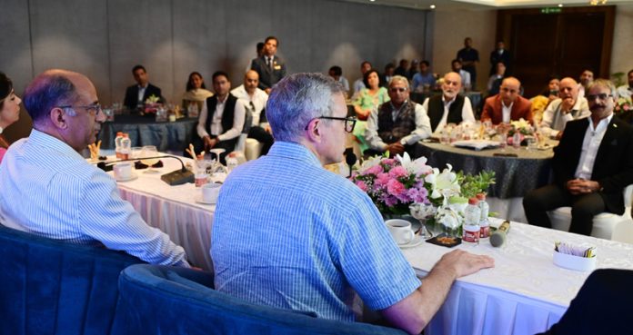 CM Omar Abdullah addressing a meeting in Srinagar on Tuesday.
