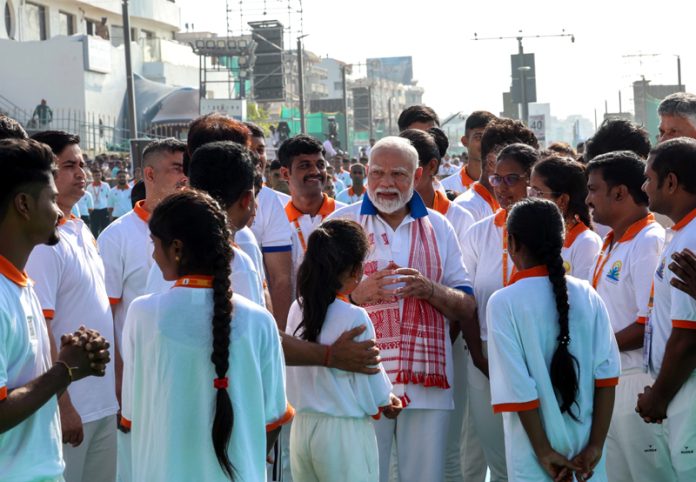 Prime Minister Narendra Modi interacts with participants during International Yoga Day celebrations in Visakhapatnam on Saturday. (UNI) Prime Minister Narendra Modi interacts with participants during International Yoga Day celebrations in Visakhapatnam on Saturday. (UNI)