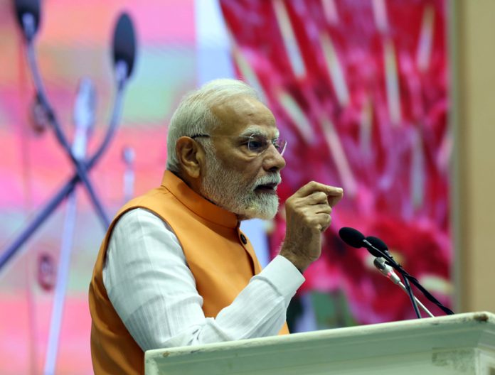 Prime Minister Narendra Modi addressing a gathering in New Delhi on Tuesday. (UNI)