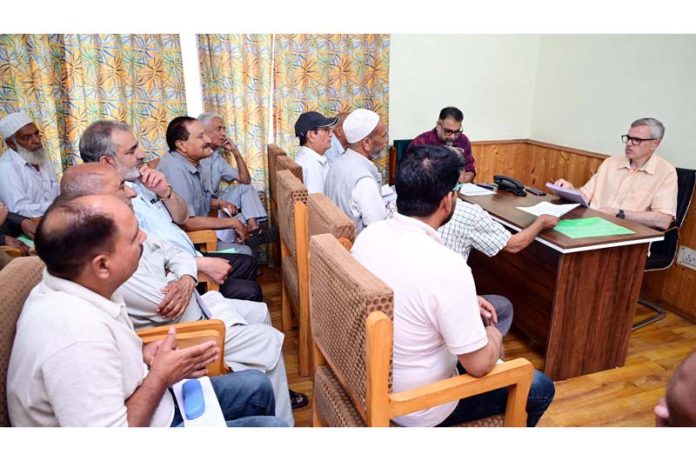 CM Omar Abdullah listening to public grievances at Raabita office in Srinagar on Friday.