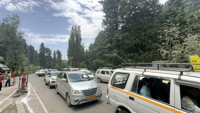 Tourists heading towards Pahalgam on Sunday. -Excelsior/ Sajad Dar