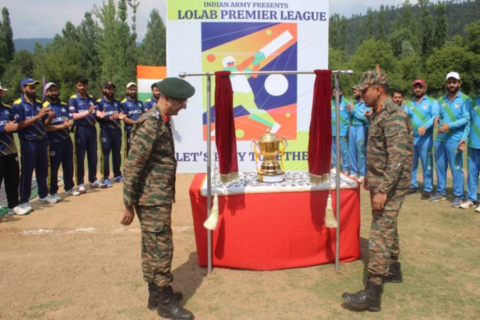 Dignitaries unveiling Lolab Premier League Trophy.