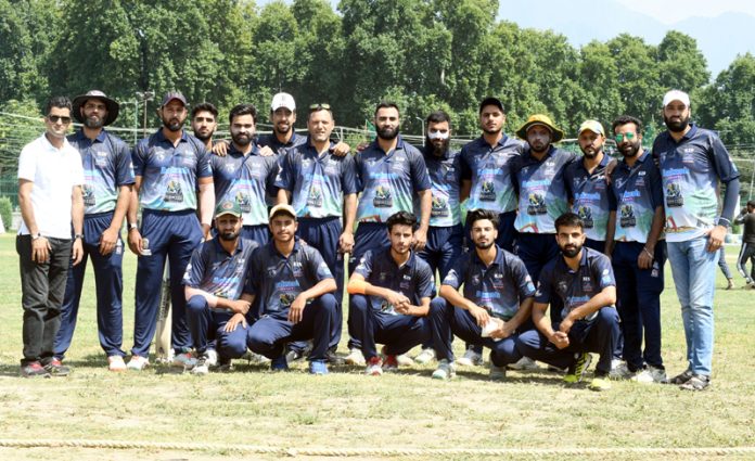 Players of SKCC, Pampore pose for a photograph with others after defeating RFCC in Hassanpora Premier League. Players of SKCC, Pampore pose for a photograph with others after defeating RFCC in Hassanpora Premier League.