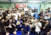 Wrestlers posing together after award ceremony at Gymnasium Hall, University of Jammu.