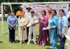 A dignitary presenting a bat to 'Player of the Match' during JKCA U-14 Boys Inter-School Cricket Tournament.