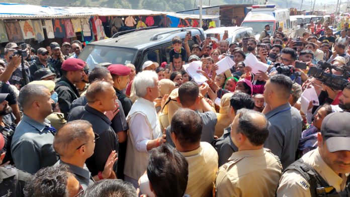 LG interacting with pilgrims at Baltal on Friday. —Excelsior/Firdous Ahmad
